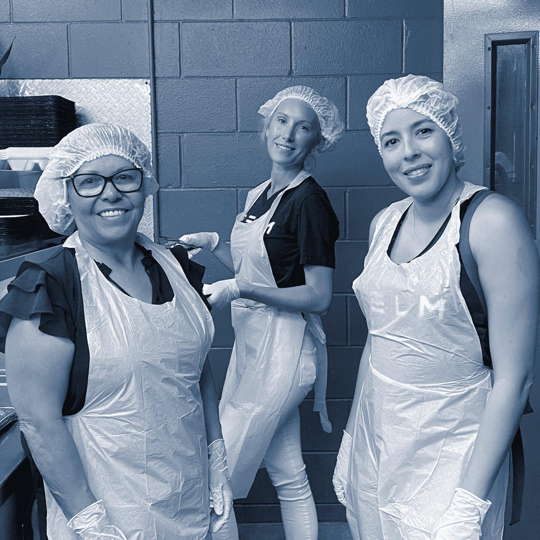 people working in a food preparation area