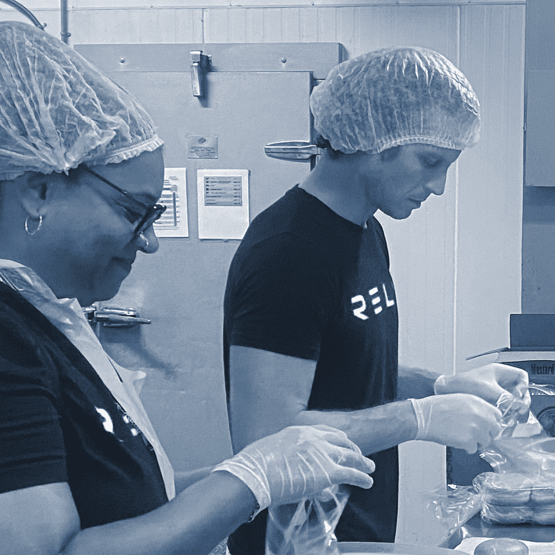 relm team members volunteering in a kitchen