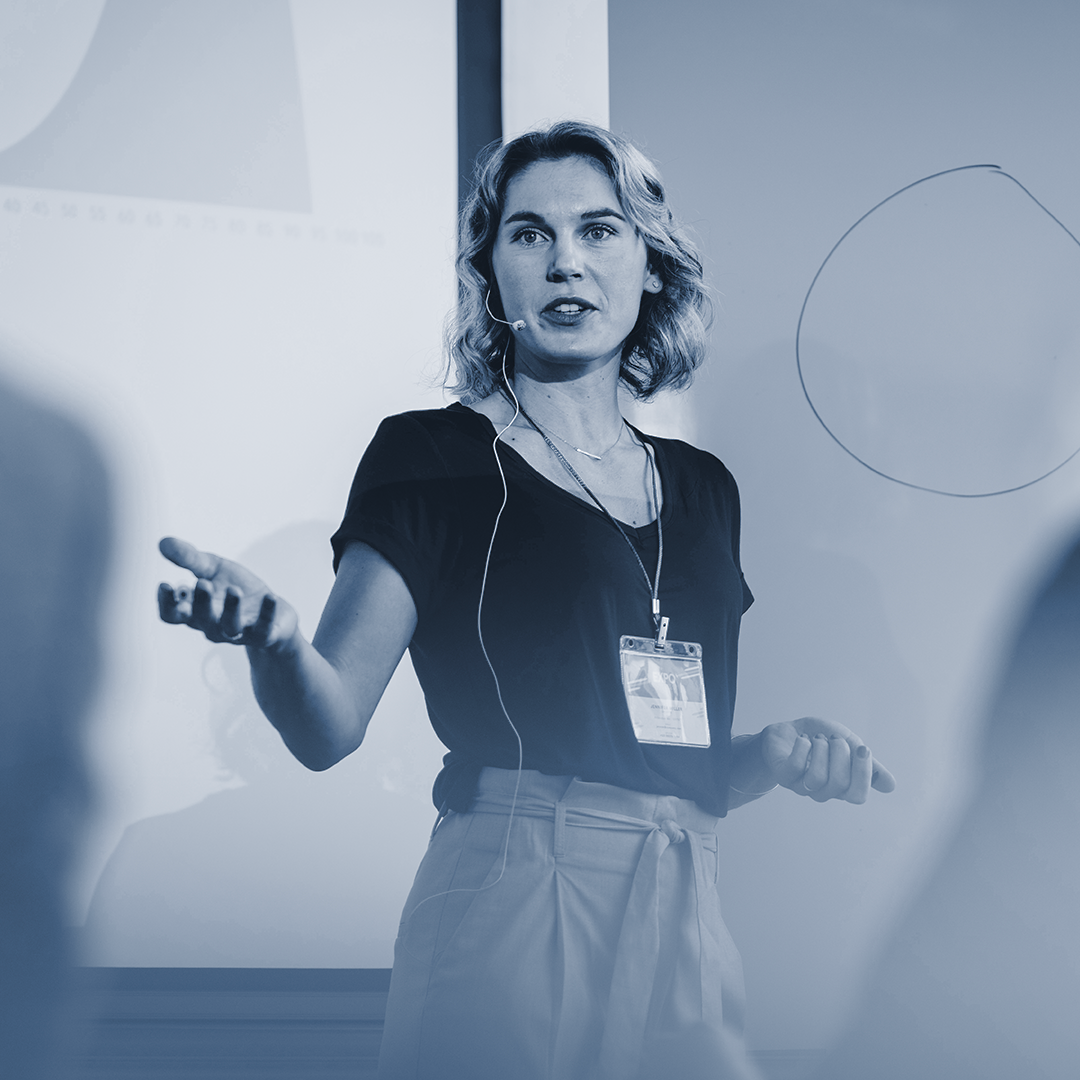 a woman conducting a talk