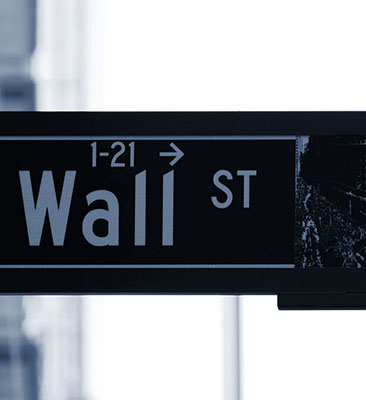 sign showing Wall Street