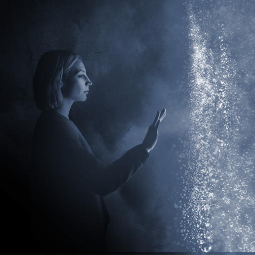 woman reaching out toward lights