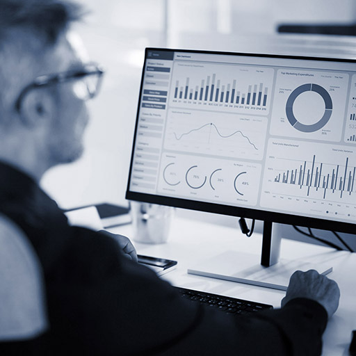 Man studying graphs on a computer