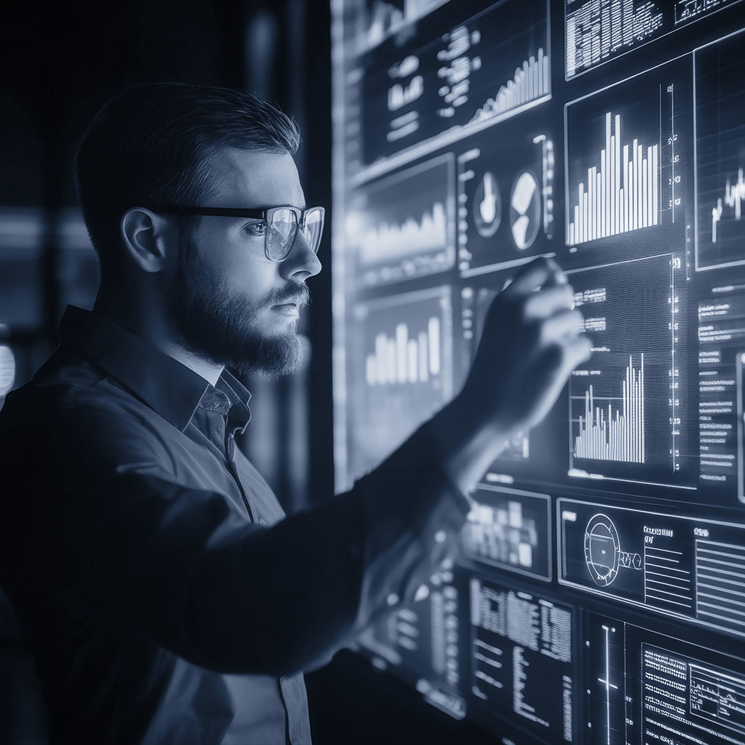Man studying graphs on a screen