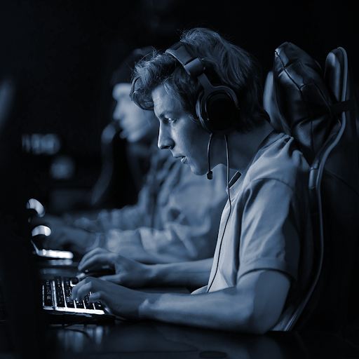 man wearing headphones working at a computer